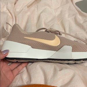 Blush pink Nike tennis shoe